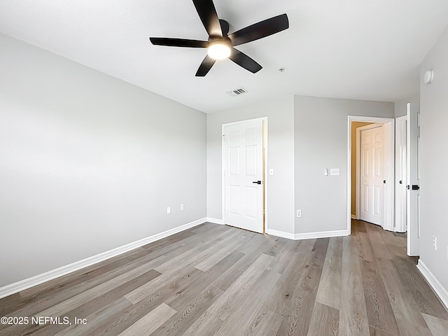 3591 Kernan Blvd S Unit 127, Jacksonville, FL 32224 - unfurnished bedroom featuring wood finished floors and ceiling fan