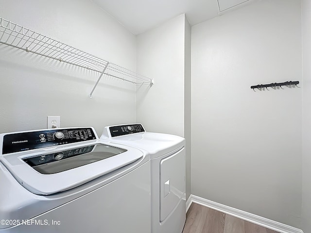 3591 Kernan Blvd S Unit 127, Jacksonville, FL 32224 - laundry area with washing machine and dryer and wood finished floors