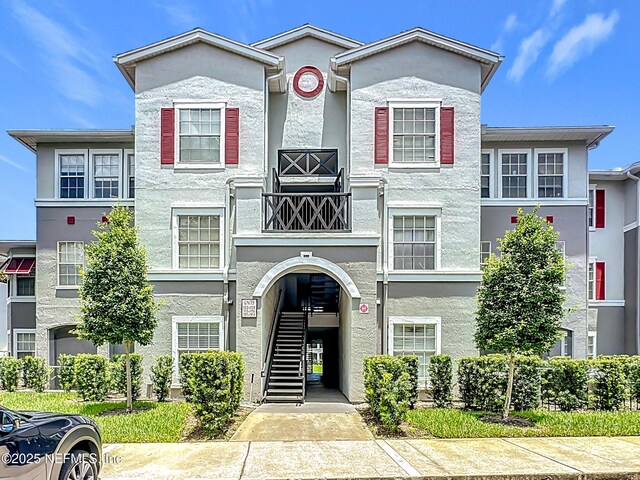 3591 Kernan Blvd S Unit 127, Jacksonville, FL 32224 - view of property featuring stucco siding