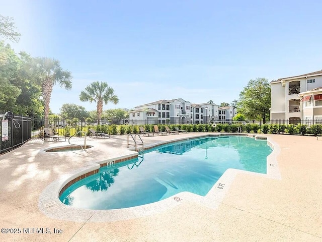 3591 Kernan Blvd S Unit 127, Jacksonville, FL 32224 - community pool with a patio area