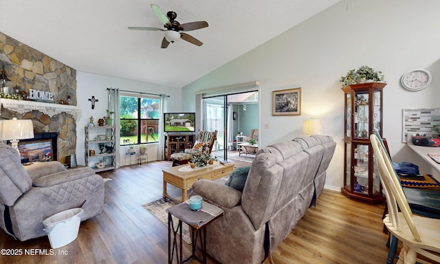 1860 Killarn Cir, Middleburg, FL 32068 - living room featuring a ceiling fan, wood finished floors, high vaulted ceiling, and a stone fireplace