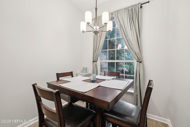12581 Ashglen Dr N, Jacksonville, FL 32224 - dining area featuring a chandelier and wood finished floors