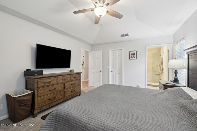 12581 Ashglen Dr N, Jacksonville, FL 32224 - carpeted bedroom with a ceiling fan, lofted ceiling, and ensuite bathroom