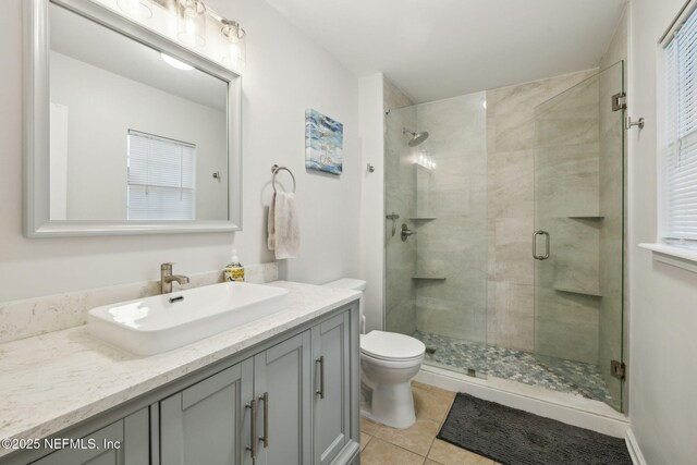 12581 Ashglen Dr N, Jacksonville, FL 32224 - full bath with vanity, a shower stall, and tile patterned flooring