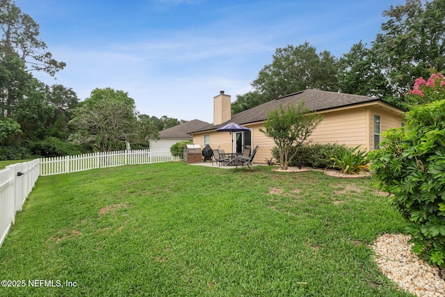 12581 Ashglen Dr N, Jacksonville, FL 32224 - fenced backyard featuring a patio
