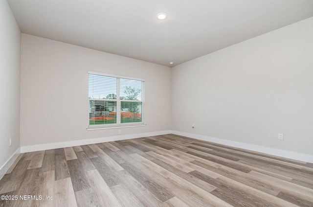 5 Squadron Pl, Palm Coast, FL 32164 - spare room with wood finished floors and recessed lighting