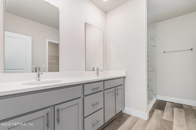 5 Squadron Pl, Palm Coast, FL 32164 - full bath with double vanity, wood finished floors, and walk in shower
