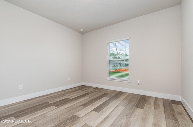 5 Squadron Pl, Palm Coast, FL 32164 - unfurnished room featuring light wood finished floors and baseboards