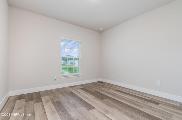 5 Squadron Pl, Palm Coast, FL 32164 - empty room featuring wood finished floors and baseboards