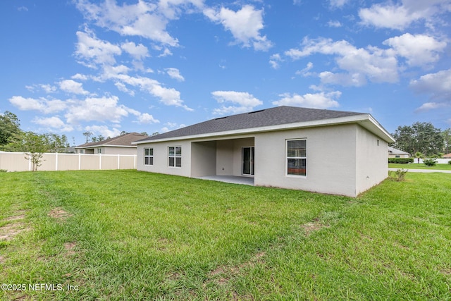 5 Squadron Pl, Palm Coast, FL 32164 - back of property with stucco siding and a patio