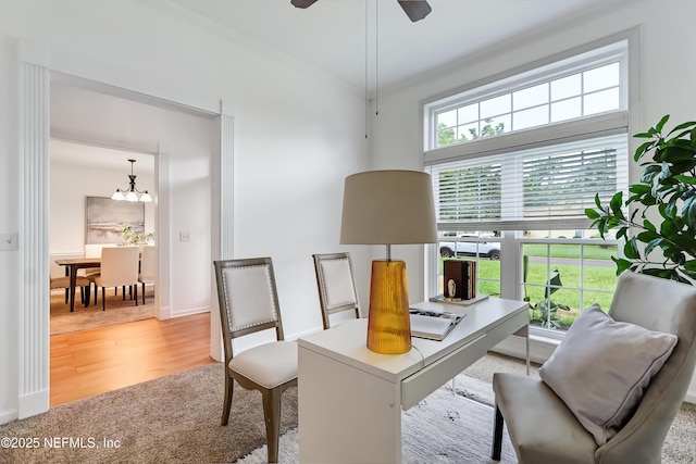 1803 Oakbreeze Ct, Jacksonville Beach, FL 32250 - office area featuring light wood-type flooring, a chandelier, and a ceiling fan