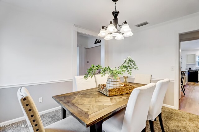 1803 Oakbreeze Ct, Jacksonville Beach, FL 32250 - dining space featuring a chandelier and carpet flooring