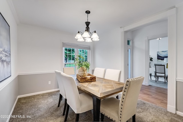 1803 Oakbreeze Ct, Jacksonville Beach, FL 32250 - carpeted dining area featuring a chandelier and baseboards