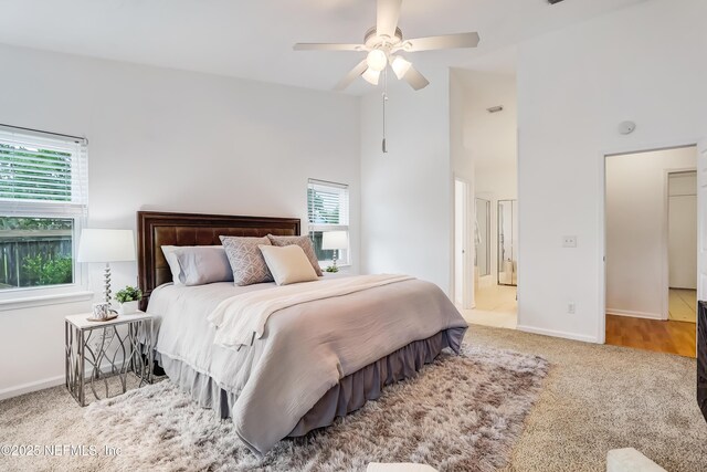 1803 Oakbreeze Ct, Jacksonville Beach, FL 32250 - carpeted bedroom with a towering ceiling and a ceiling fan