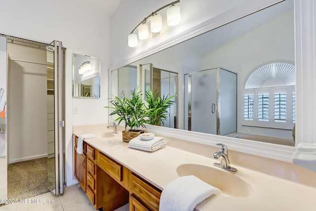 1803 Oakbreeze Ct, Jacksonville Beach, FL 32250 - full bathroom featuring a shower stall, double vanity, tile patterned floors, and a bath