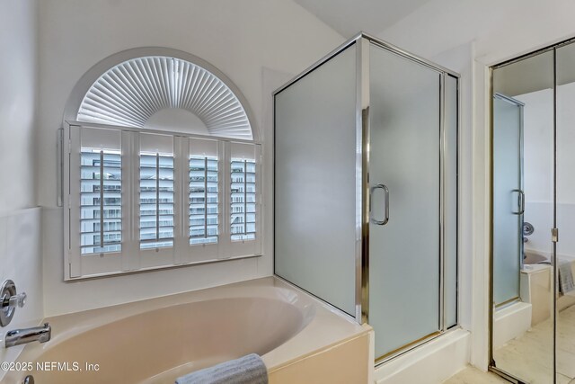 1803 Oakbreeze Ct, Jacksonville Beach, FL 32250 - full bathroom with a shower stall and a bath