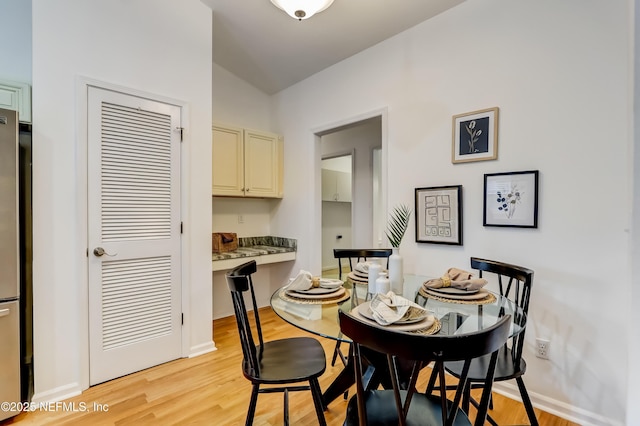 1803 Oakbreeze Ct, Jacksonville Beach, FL 32250 - dining area featuring light wood finished floors and lofted ceiling