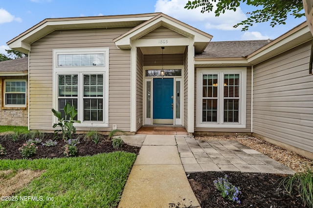 1803 Oakbreeze Ct, Jacksonville Beach, FL 32250 - entrance to property with a shingled roof
