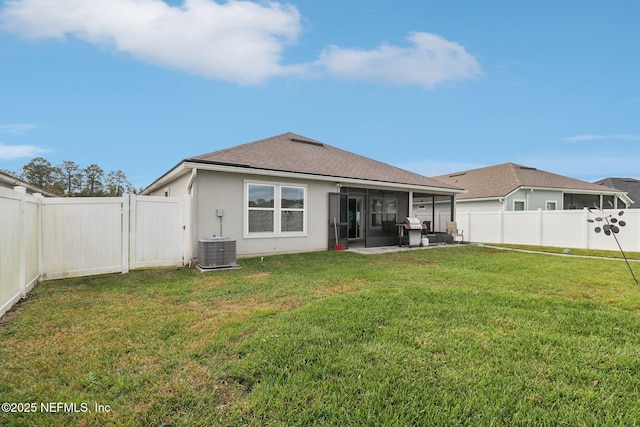 3121 Pretty Cv, Green Cove Springs, FL 32043 - back of house featuring a sunroom, a fenced backyard, a shingled roof, and stucco siding