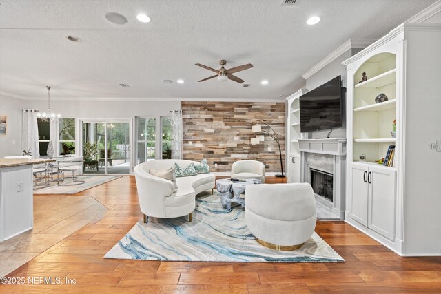 201 History Pl, Saint Augustine, FL 32095 - living area featuring ornamental molding, a high end fireplace, wood-type flooring, ceiling fan, and recessed lighting