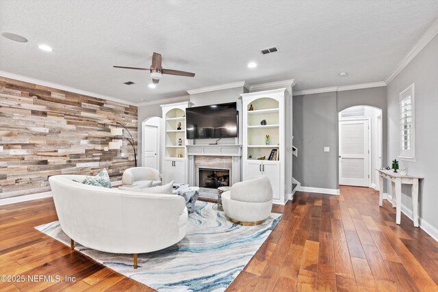 201 History Pl, Saint Augustine, FL 32095 - living area featuring arched walkways, ceiling fan, a premium fireplace, recessed lighting, and hardwood / wood-style flooring