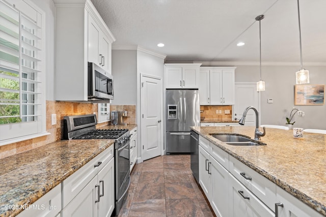 201 History Pl, Saint Augustine, FL 32095 - kitchen featuring stainless steel appliances, crown molding, white cabinetry, recessed lighting, and decorative light fixtures