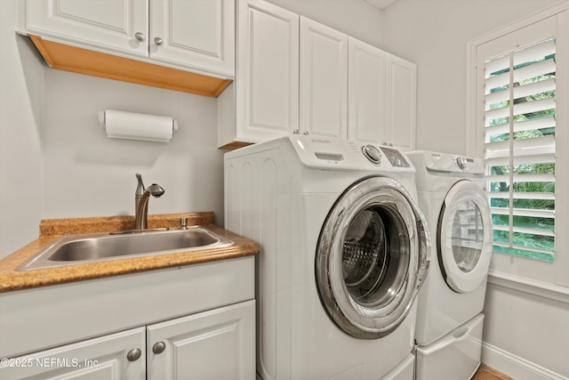 201 History Pl, Saint Augustine, FL 32095 - laundry area with cabinet space and washing machine and clothes dryer