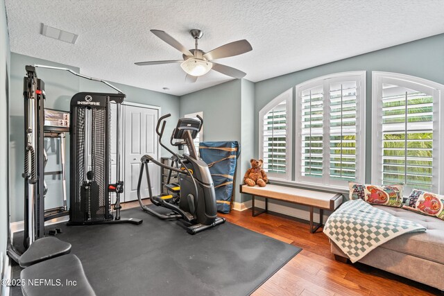 201 History Pl, Saint Augustine, FL 32095 - workout room with ceiling fan, a textured ceiling, and wood finished floors