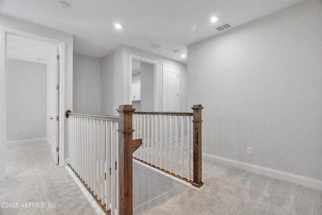 3491 Marsh Reserve Blvd, Jacksonville, FL 32224 - corridor with an upstairs landing, carpet flooring, and recessed lighting