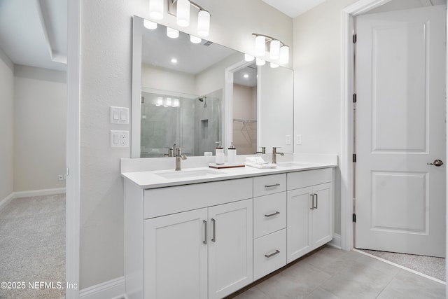 3491 Marsh Reserve Blvd, Jacksonville, FL 32224 - bathroom with double vanity, a shower stall, and a walk in closet
