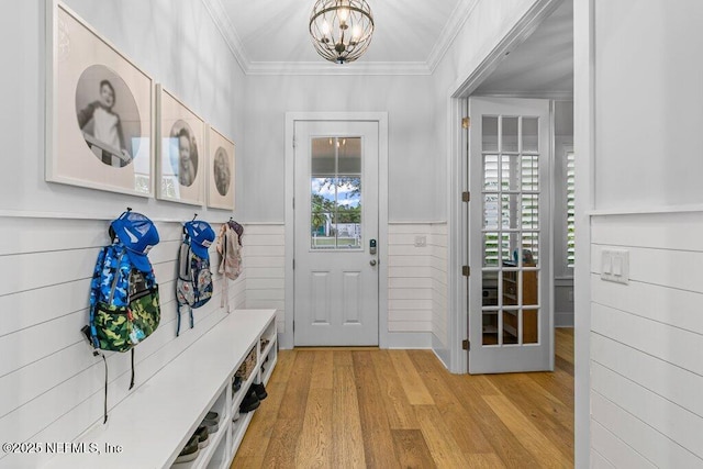 791 Paradise Ln, Atlantic Beach, FL 32233 - mudroom with plenty of natural light, crown molding, light wood-style flooring, a chandelier, and a wainscoted wall