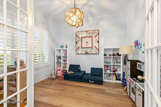 791 Paradise Ln, Atlantic Beach, FL 32233 - sitting room with a chandelier, wood finished floors, and crown molding