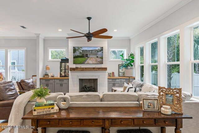 791 Paradise Ln, Atlantic Beach, FL 32233 - living area featuring a ceiling fan, recessed lighting, crown molding, and a fireplace