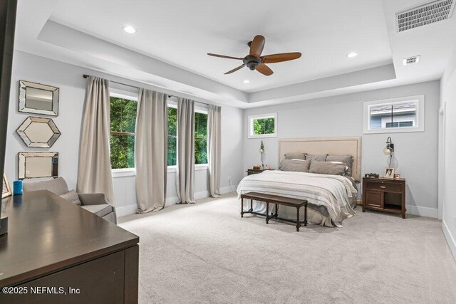 791 Paradise Ln, Atlantic Beach, FL 32233 - bedroom with a raised ceiling, light colored carpet, recessed lighting, and a ceiling fan