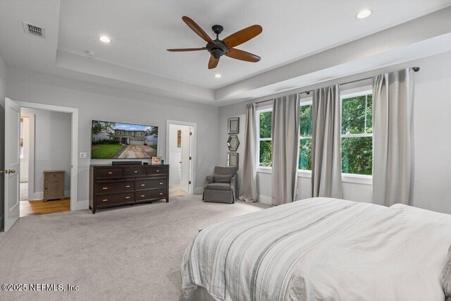 791 Paradise Ln, Atlantic Beach, FL 32233 - bedroom featuring light carpet, a tray ceiling, recessed lighting, and a ceiling fan