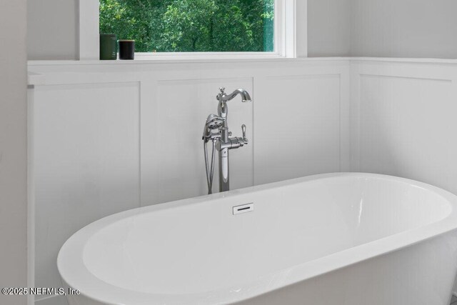 791 Paradise Ln, Atlantic Beach, FL 32233 - bathroom view of a freestanding bath and a decorative wall
