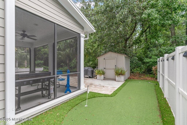 791 Paradise Ln, Atlantic Beach, FL 32233 - view of yard with a putting green, a patio area, a storage unit, ceiling fan, and a sunroom