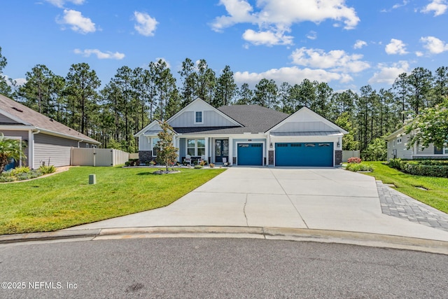 207 Hertford Bridge Way, Saint Johns, FL 32259 - view of front of home with board and batten siding, an attached garage, driveway, and a shingled roof
