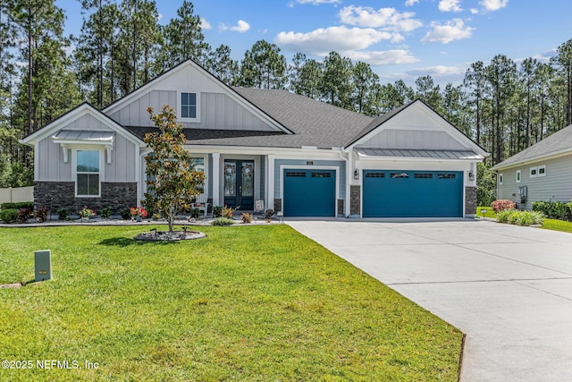 207 Hertford Bridge Way, Saint Johns, FL 32259 - modern farmhouse with board and batten siding, an attached garage, stone siding, driveway, and french doors