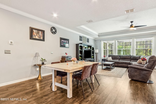 207 Hertford Bridge Way, Saint Johns, FL 32259 - dining room with crown molding, wood finished floors, ceiling fan, a tray ceiling, and a textured ceiling