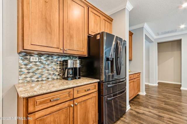 207 Hertford Bridge Way, Saint Johns, FL 32259 - kitchen featuring stainless steel fridge, backsplash, dark wood-style floors, crown molding, and a textured ceiling
