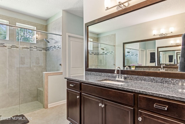 207 Hertford Bridge Way, Saint Johns, FL 32259 - full bathroom featuring a shower stall, vanity, tile patterned flooring, and a textured ceiling