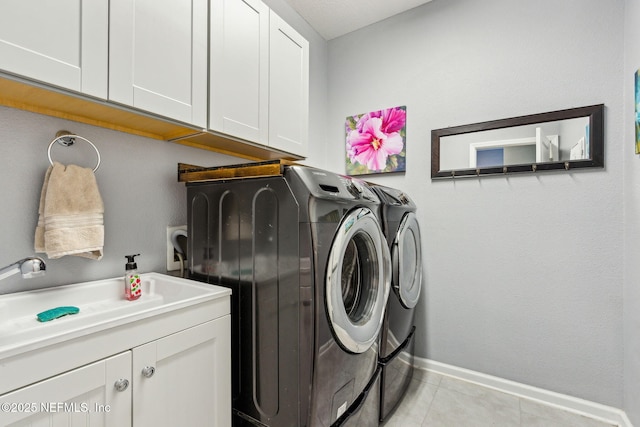 207 Hertford Bridge Way, Saint Johns, FL 32259 - washroom featuring washing machine and clothes dryer, cabinet space, and light tile patterned floors