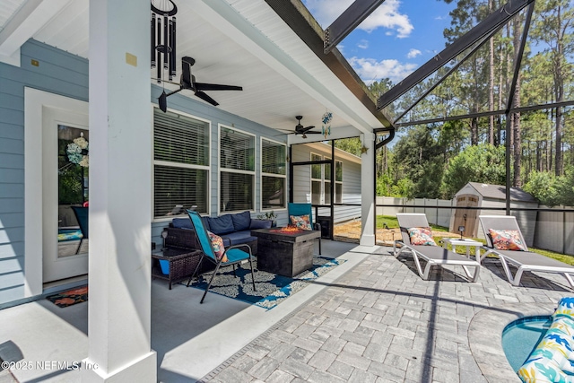 207 Hertford Bridge Way, Saint Johns, FL 32259 - view of patio / terrace with ceiling fan, a storage unit, an outdoor living space with a fire pit, and glass enclosure