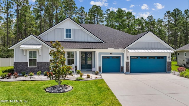 207 Hertford Bridge Way, Saint Johns, FL 32259 - modern inspired farmhouse featuring board and batten siding, french doors, an attached garage, and stone siding