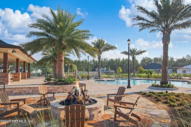 207 Hertford Bridge Way, Saint Johns, FL 32259 - community pool with an outdoor fire pit and a patio area