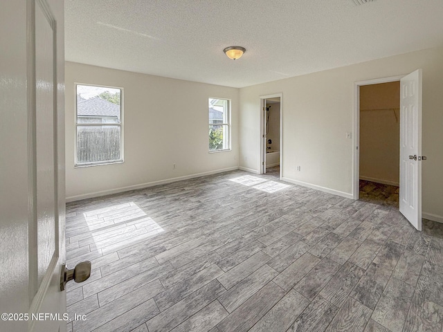 1736 Ashwood Cir, Middleburg, FL 32068 - unfurnished bedroom featuring wood tiled floors and a textured ceiling