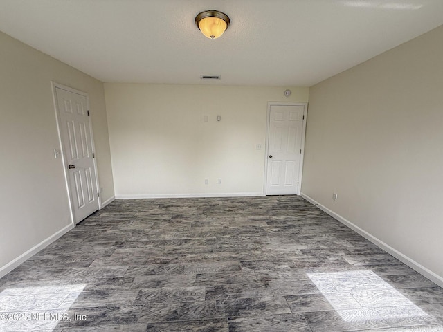 1736 Ashwood Cir, Middleburg, FL 32068 - unfurnished room featuring baseboards and wood finished floors