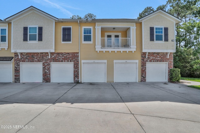 218 Larkin Pl Unit 101, Saint Johns, FL 32259 - multi unit property featuring driveway, a garage, and brick siding