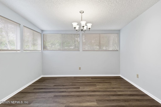 6202 Columbine Dr, Jacksonville, FL 32211 - spare room with a chandelier, a textured ceiling, and wood finished floors